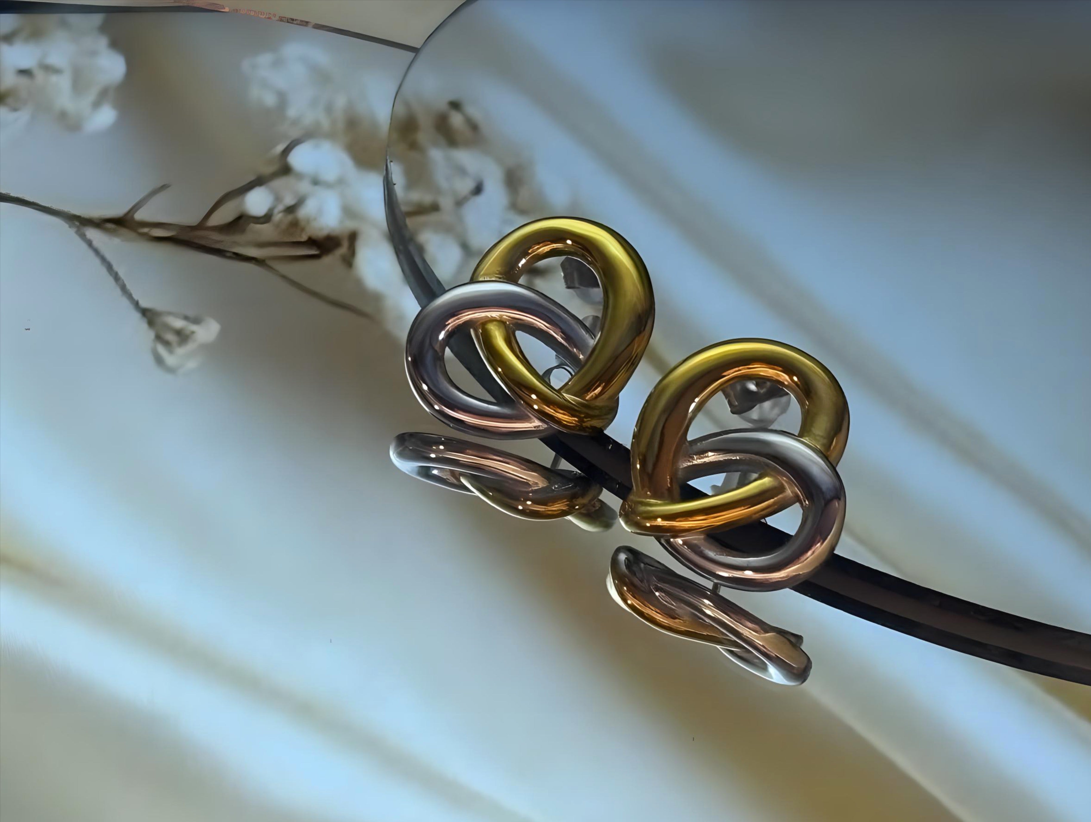 Gold and silver stainless steel 18k gold plated stud earrings.